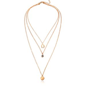 Gelaagde goudkleurige ketting Wishing Bone muntje en Zirkonia