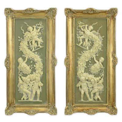 A PAIR OF FRAMED RESIN PLAQUES