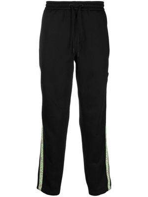 Calvin Klein Jeans pantalon de jogging à bandes logo - Noir