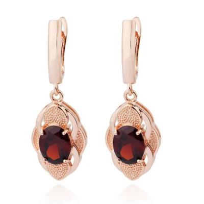 Deja Jewels Oorbellen met Ovale Hangers - Dames, Rosegoudkleurige Afwerking, Rode Glassteen