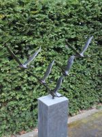 5 bronzen zwanen