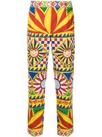 Dolce & Gabbana pantalon à imprimé all-over - Rouge