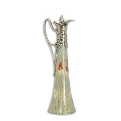 A BRONZE MOUNTED PORCELAIN CLARET JUG - SILVER PLATED