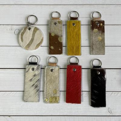 Sleutelhangers van Koeienhuid & Springbok 10x4cm (8 stks)