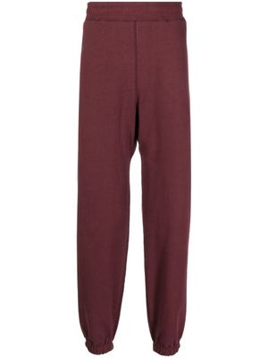 Suicoke pantalon de jogging à logo imprimé - Rouge