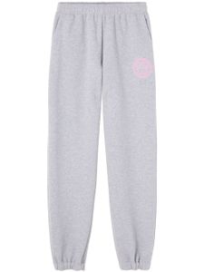 Versace pantalon de jogging en coton à logo imprimé - Gris