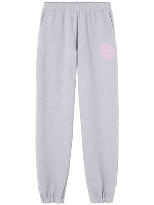 Versace pantalon de jogging en coton à logo imprimé - Gris
