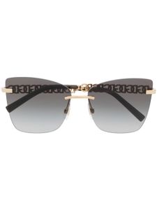 Dolce & Gabbana Eyewear lunettes de soleil à monture papillon - Noir