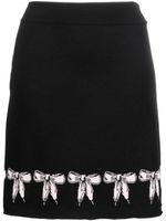 Boutique Moschino jupe en maille intarsia à détail de nœud - Noir Boutique Moschino jupe en maille intarsia à détail de nœud - Noir