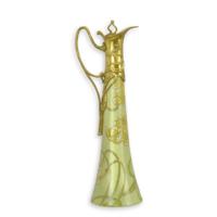 A BRONZE MOUNTED PORCELAIN CLARET JUG A BRONZE MOUNTED PORCELAIN CLARET JUG