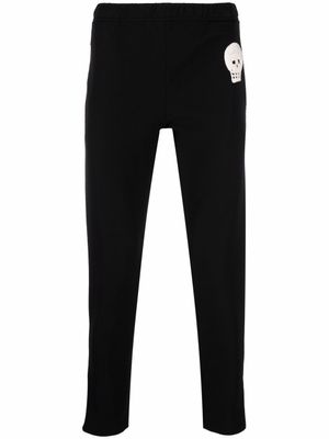 Alexander McQueen pantalon de jogging slim à patch tête de mort - Noir