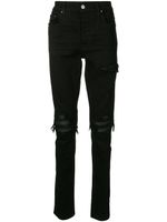 AMIRI jean skinny à effet usé - Noir