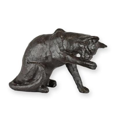 A BRONZE SCULPTURE OF A CAT