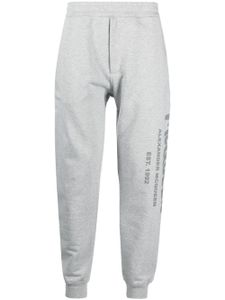 Alexander McQueen pantalon de jogging à logo imprimé - Gris