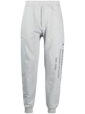 Alexander McQueen pantalon de jogging à logo imprimé - Gris