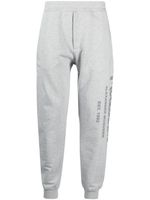 Alexander McQueen pantalon de jogging à logo imprimé - Gris - thumbnail