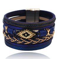 Blauwe dames armband met kristal en goudkleurige details - thumbnail