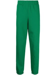 Lacoste pantalon de jogging en coton biologique à logo imprimé - Vert