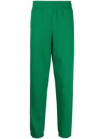 Lacoste pantalon de jogging en coton biologique à logo imprimé - Vert