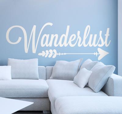 Tekst muursticker Wanderlust pijl