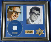 Buddy Holly's foto met handtekening en plectrum