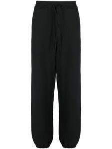 Y-3 pantalon de jogging en coton à patch logo - Noir