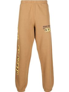 Heron Preston pantalon de jogging à logo imprimé - Marron