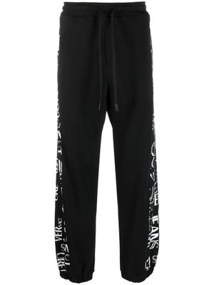 Versace Jeans Couture pantalon de jogging en coton à logo imprimé - Noir