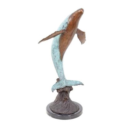 A BRONZE SCULPTURE OF A WHALE