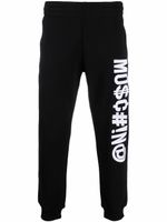 Moschino pantalon de jogging Symbols à logo brodé - Noir