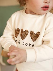 Baby sweater met bedrukte boodschap vanille