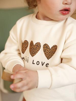 Baby sweater met bedrukte boodschap vanille