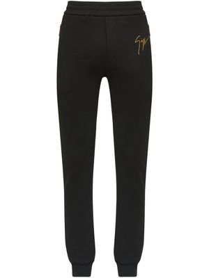 Giuseppe Zanotti pantalon de jogging à logo imprimé - Noir