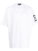 Black Comme Des Garçons t-shirt à slogan imprimé - Blanc