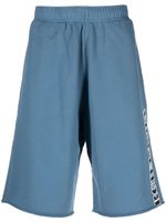 MM6 Maison Margiela pantalon de jogging en coton à logo imprimé - Bleu