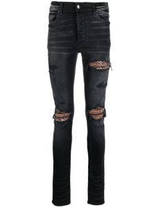 AMIRI jean skinny à effet usé - Noir