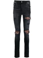 AMIRI jean skinny à effet usé - Noir - thumbnail