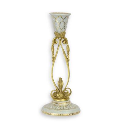 A BRONZE MOUNTED PORCELAIN CANDLE-STICK