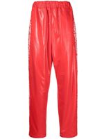 Junya Watanabe MAN pantalon de jogging à imprimé graphique - Rouge - thumbnail