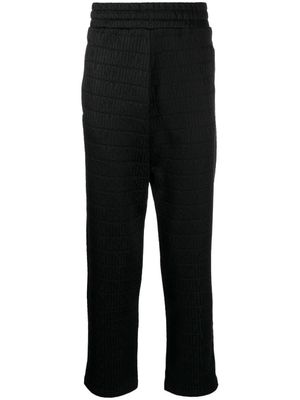 Moschino pantalon à logo imprimé - Noir