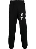 44 LABEL GROUP pantalon de jogging en coton à logo imprimé - Noir