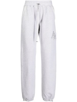 AMIRI pantalon de jogging Staggered à logo brodé - Gris