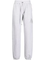 AMIRI pantalon de jogging Staggered à logo brodé - Gris