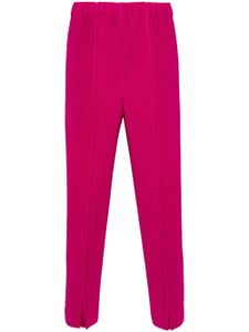 Homme Plissé Issey Miyake pantalon à taille élastiquée - Rose