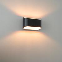 Volans nero oro by LUSENZ - Ovaalvormige wandlamp met up and downlight, matzwarte coating en goudkleurig interieur