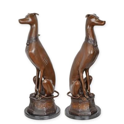 A BRONZE PAIR OF SITTING WHIPPETS