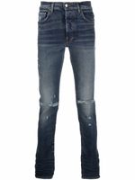 AMIRI jean skinny à effet délavé - Bleu