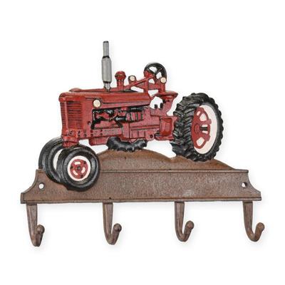 A CAST IRON RED TRACTOR COAT HOOK