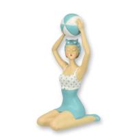A RESIN FIGURINE OF A RETRO BEACH GIRL A RESIN FIGURINE OF A RETRO BEACH GIRL