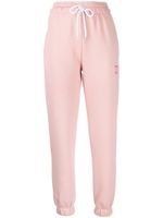BAPY BY *A BATHING APE® pantalon de jogging à slogan brodé - Rose